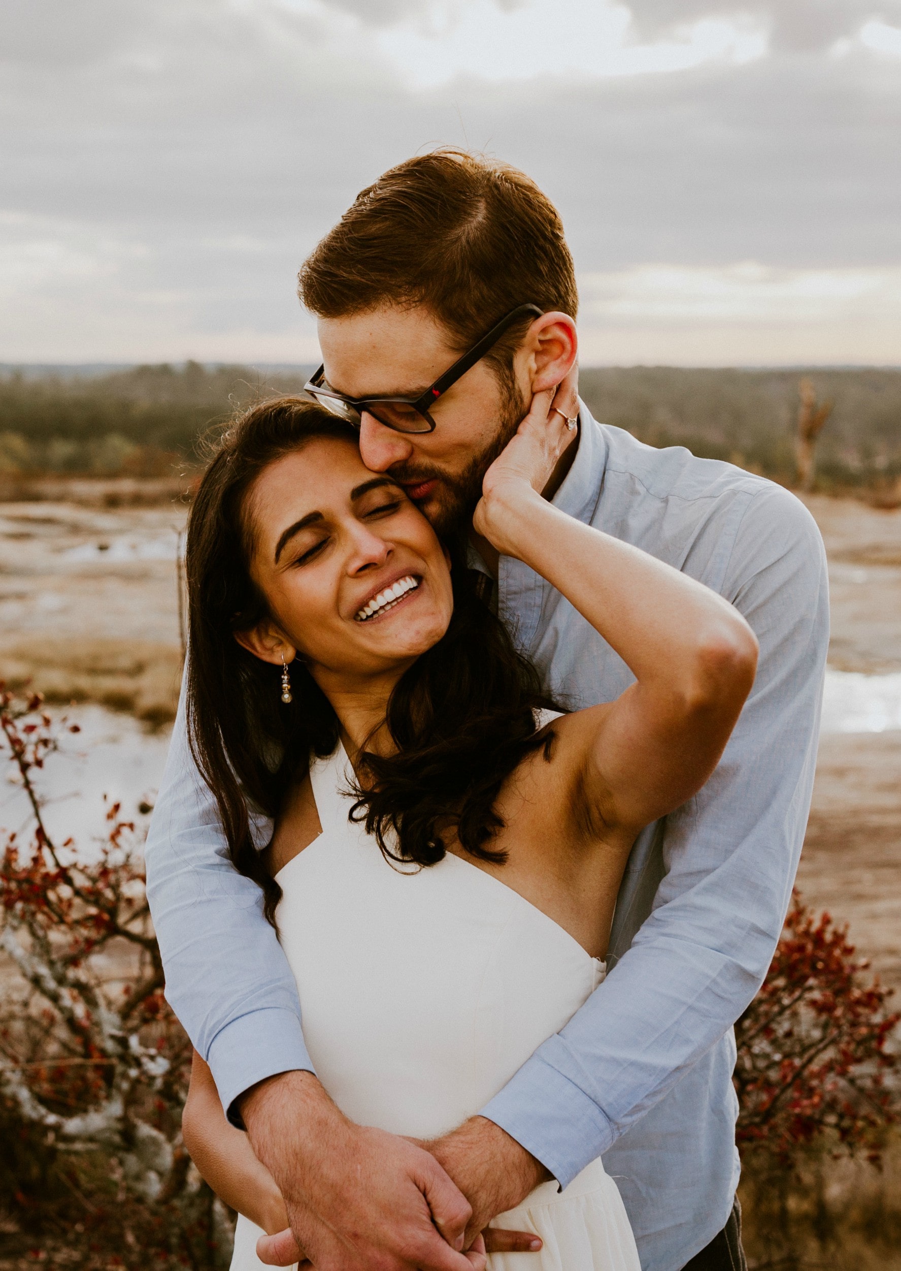 Photo of Logan and Sharvari in an embrace.